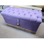 A lilac button upholstered ottoman with a fringed border to the base, 48cm h x 95cm w Location: