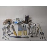 A selection of silver plated flatware and other items to include rat tail cutlery, wine bottle