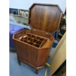 A reproduction wine cooler having a hinged octagonal top, twin carrying handles and lift out nine