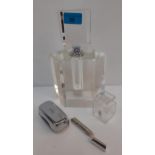 A group of decorative dressing table items to include a large clear glass fragrance bottle with