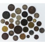 A collection of 19th century and later coinage and tokens to include William IV farthing, 1811