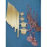 A quantity of interconnecting gold painted curtain poles with matching central curtain swag ornament