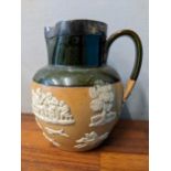 A Royal Doulton harvest jug mounted with a silver rim Location: