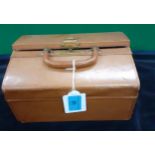 A small vintage and fitted tan leather travel case and contents to include gold tone metal and glass