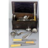 A collection of silver plated and other flatware housed in an oak box Location: