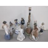 Seven Nao porcelain figures to include a figural table lamp of a girl by a tree Location: