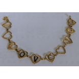 A 9ct gold bracelet with heart links, spelling I Love You, 8.1g Location: