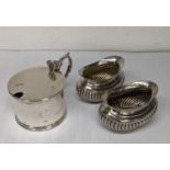 A pair of silver salts and a silver lidded mustard, 110g Location: