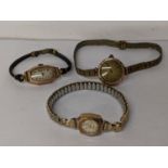 Three early/mid 20th century 9ct gold ladies watches, two with straps Location: