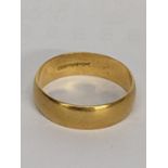 A 18ct gold wedding ring, 6.7g Location: