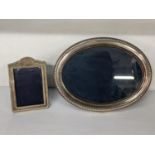 Two silver photograph frames to include an oval frame hallmarked Sheffield 1989, 16.5cm high