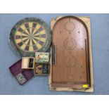 An Elkadart dart board, together with a Shove Ha'penny board, Jacques & Son new game of Halma and