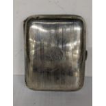A 1920's silver cigarette case engraved with initials, hallmarked London 1923, 77.6g Location: