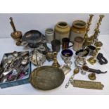 A mixed lot to include stoneware bottles, silver plate to include a sugar bowl, brass candlesticks