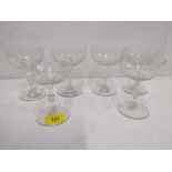 A set of six cut Champagne coupes circa 1900, faceted stems with central knops raising to a bowl,