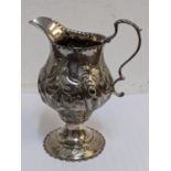 An early 19th century silver embossed cream jug hallmarked London 1819, 81.3g Location: