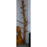 A large tree root sculpture with loose branches, 240cm h Location: