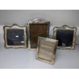 Four silver photograph frames to include a matching pair hallmarked Birmingham 1992, 13cm x 12.5cm