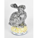 A studio pottery model of a grey rabbit by David Cleverly (contemporary), the circular base with