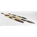 African tribal weapons comprising hide bound hunting spear and smaller example, sword with similar