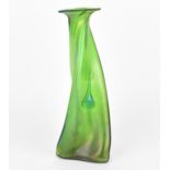 An Art Nouveau kralik style iridescent green vase, of twisted triform with applied drop trails, with