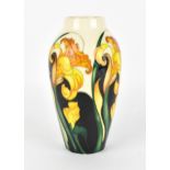 A Moorcroft pottery trial vase in a spring daffodil pattern, with tubelined blooms and leaves on a