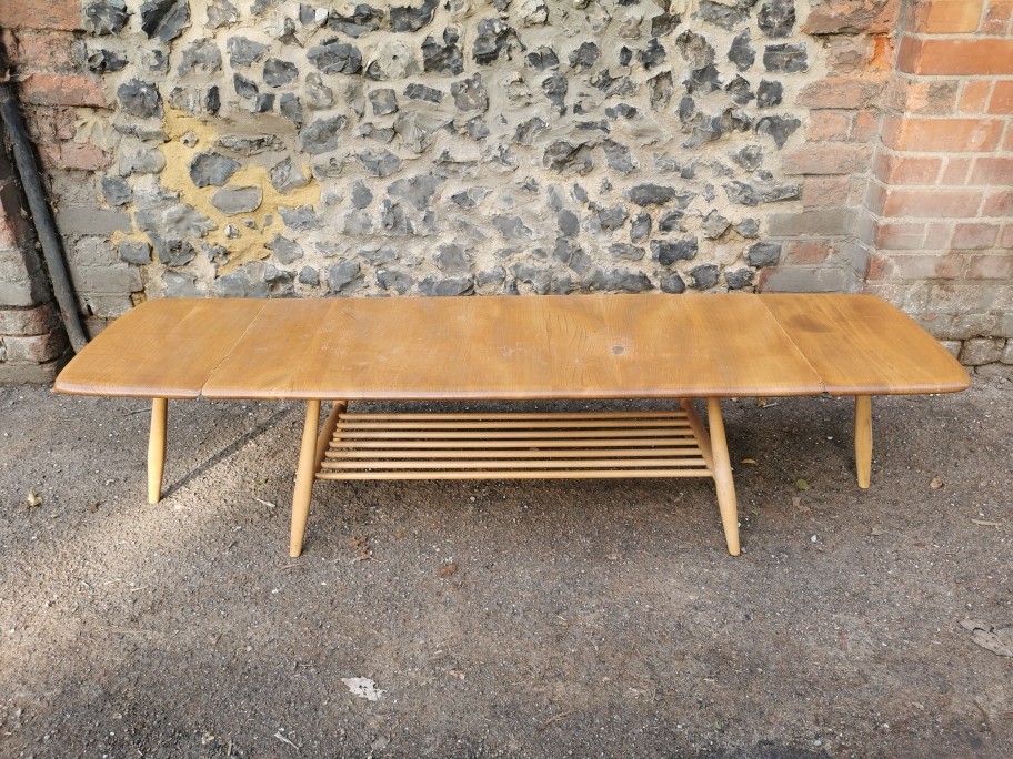 An Ercol style blonde elm and beech drop-leaf Windsor coffee table, no visible label, total width - Image 7 of 7