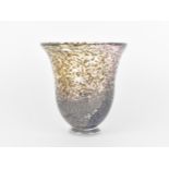 A hand blown studio glass vase by Dan Aston, with everted rim and speckled lilac body, the underside
