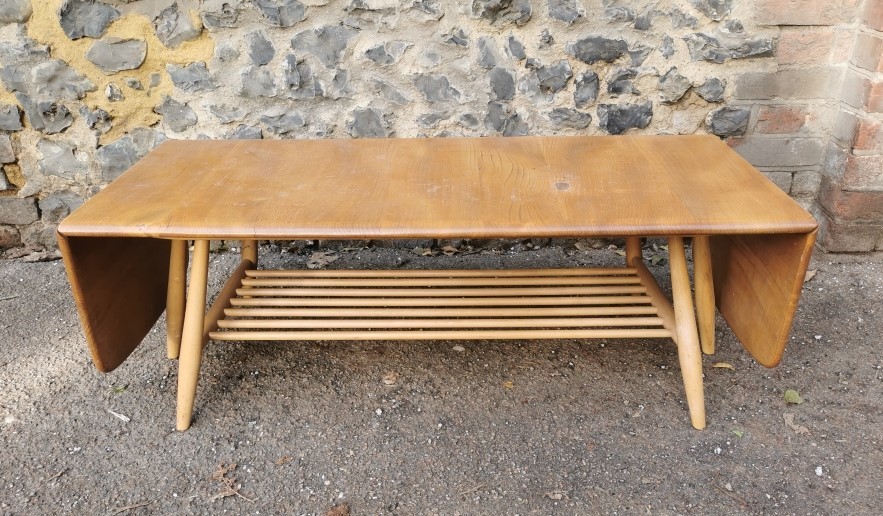 An Ercol style blonde elm and beech drop-leaf Windsor coffee table, no visible label, total width