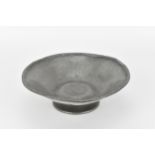 A Liberty of London pewter bowl on stand, of circular form with hammered effect throughout, on a
