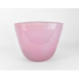 A large studio glass vase by Henry Dean, of compressed oval form in pink, signed to the front, 29 cm