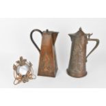 An Arts & Crafts Joseph Sankey & Sons copper jug, of tapered cylindrical form with embossed floral