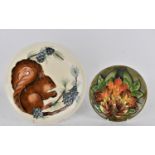 A Moorcroft ceramic year plate designed by Rachel Bishop for the year 1995 with a squirrel and