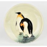 A limited edition Moorcroft ceramic plate designed by Sally Tuffin, no.13/150, in the penguin