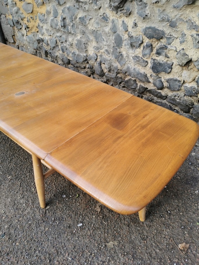 An Ercol style blonde elm and beech drop-leaf Windsor coffee table, no visible label, total width - Image 5 of 7