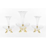 A three-piece Baccarat crystal and ormolu centrepiece, designed as three petal-rimmed trumpet