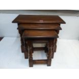 A nesting set of three Old Charm occasional oak tables Location: