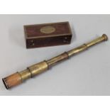 A small brass pocket telescope signed Thomas. J. Evans, London, in fitted box, signed to top