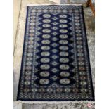 A small Bokhara blue ground rug, 155cm x 96cm Location: