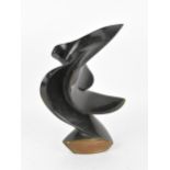 A contemporary Zimbabwean shona sculpture, modelled as an abstract wave, signed to the back of the