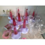A set of six etched wine glasses and nine epergne glass conical vases in cranberry with milk shading