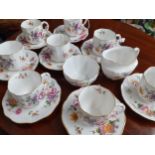 A set of eight 'Derby Posies' coffee cans with matching saucers, a sugar bowl and a milk jug
