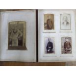 A Victorian leather bound photograph album containing various late Victorian photographs of