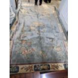 A Chinese handwoven silk blue ground rug 183cm x 274cm Location: