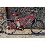 An Explorer Ventura X gents electric bicycle in red and black colourway with charger A/F, battery