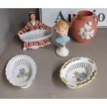 A pair of small oval Herend baskets with floral decoration, a Russian china figure of a lady holding