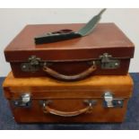 Two early to mid 20th Century leather suitcases together with a late 19th/early 20th Century cased