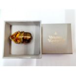 Vivienne Westwood-An articulated copper coloured ring in the form of 4 sections of armour with an