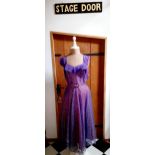 A 1940's sleeveless purple bespoke cocktail dress with silver thread detail to the netted outer