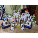 A group of Victorian and later Staffordshire flatback figures and spills to include a seated